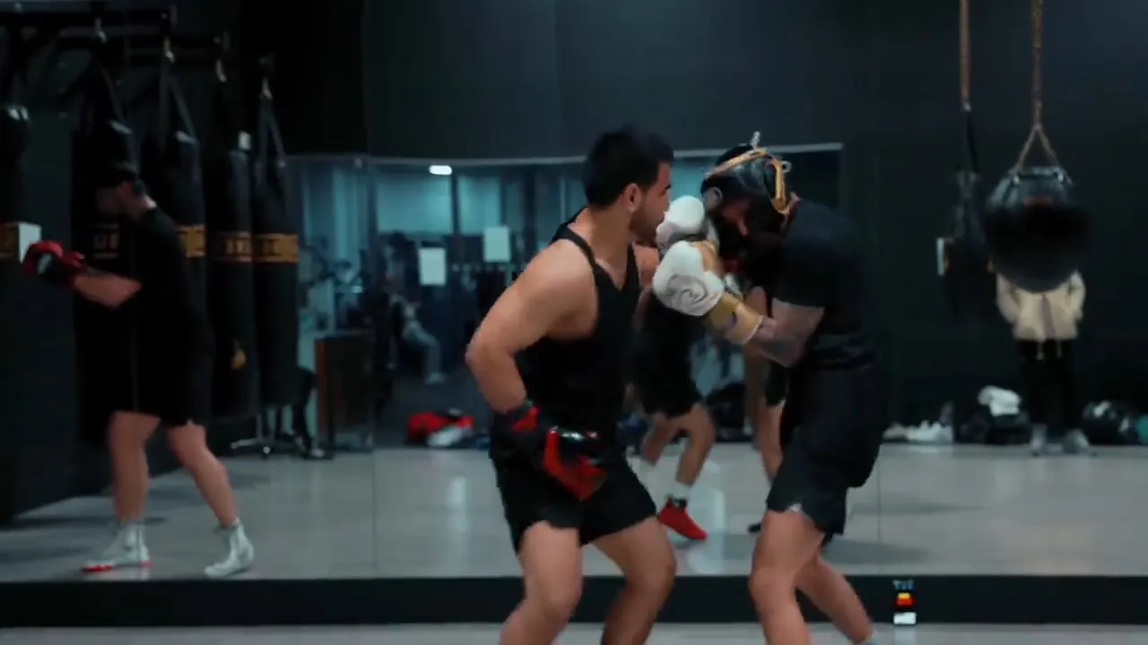 Two members sparring in the ring at The Boxer’s Club